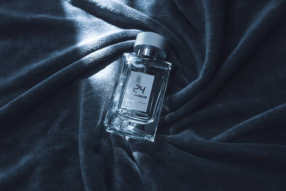 Minimalist perfume notes flat lay featuring lavender and citrus elements