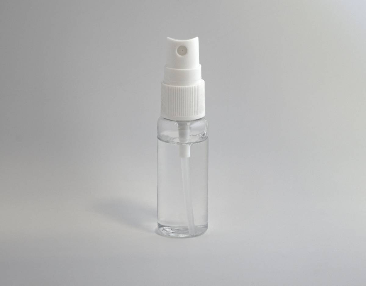 Woman gently spritzing casual aroma mist on wrist